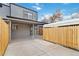 Backyard boasts a covered patio area with access to off street parking at 1440 S Logan St, Denver, CO 80210