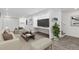 Finished basement with a living area, built-in workspace, and stairs at 1440 S Logan St, Denver, CO 80210
