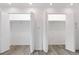 Spacious walk-in closet offers ample storage with built-in shelving and lighting, ideal for organization at 1440 S Logan St, Denver, CO 80210