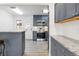 Modern kitchen with granite countertops and gray cabinets at 1440 S Logan St, Denver, CO 80210