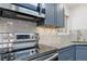 Stainless steel Samsung range and microwave in updated kitchen at 1440 S Logan St, Denver, CO 80210