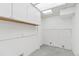 This functional laundry room has white cabinetry and peg board at 1440 S Logan St, Denver, CO 80210