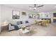 Bright living room features stylish decor, comfortable seating, and an open layout to the dining area at 1440 S Logan St, Denver, CO 80210