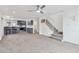Spacious living room with carpeted floor, ceiling fan, and large window at 1440 S Logan St, Denver, CO 80210