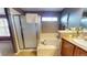 Bathroom featuring a shower and separate tub with tiled flooring and neutral paint at 553 Hanging Rock Pl, Castle Rock, CO 80108