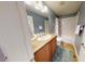 Bathroom featuring a shower and separate tub with vanity at 553 Hanging Rock Pl, Castle Rock, CO 80108