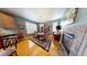 Elegant dining room with hardwood floors, a fireplace, and a china cabinet for storage at 553 Hanging Rock Pl, Castle Rock, CO 80108