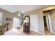 Inviting foyer with hardwood floors, a decorative mirror, and ample natural light from the front door at 553 Hanging Rock Pl, Castle Rock, CO 80108