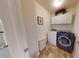 Laundry room with a side-by-side washer and dryer and white upper cabinets at 553 Hanging Rock Pl, Castle Rock, CO 80108