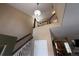 Open staircase with stylish lighting fixtures leads to the upper level of the home at 553 Hanging Rock Pl, Castle Rock, CO 80108