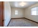 Empty bedroom with neutral walls and carpet flooring at 1165 Garrison St, Lakewood, CO 80215