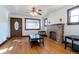 Living room with hardwood floors, fireplace, and large windows at 1165 Garrison St, Lakewood, CO 80215