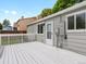 White deck offers backyard views with a wooden fence and a house with light-gray siding at 4858 S Quintero Cir, Aurora, CO 80015