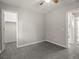 Bedroom view towards closet and entrance, showing neutral decor and ceiling fan at 4858 S Quintero Cir, Aurora, CO 80015