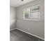 Bedroom featuring neutral walls, carpet, trim, and a window with blinds at 4858 S Quintero Cir, Aurora, CO 80015