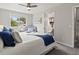 Bedroom view highlighting the ensuite bathroom and natural light from the exterior window at 4858 S Quintero Cir, Aurora, CO 80015