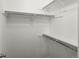 Bright walk-in closet featuring built-in shelving offering ample storage space at 4858 S Quintero Cir, Aurora, CO 80015