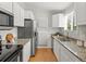 Well-equipped kitchen featuring stainless steel appliances and ample storage at 4858 S Quintero Cir, Aurora, CO 80015