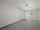 Spacious living room with gray carpet, neutral walls, and good light at 4858 S Quintero Cir, Aurora, CO 80015