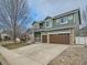 Charming two-story home with a long driveway and a two-car garage at 4941 Silverleaf Ave, Firestone, CO 80504