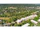 Aerial view of the building surrounded by trees and green spaces at 6000 W Floyd Ave # 214, Denver, CO 80227
