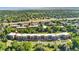 Building aerial view, showcasing manicured greenery and exterior design at 6000 W Floyd Ave # 214, Denver, CO 80227