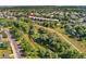 Aerial view of complex nestled near a creek, walking trail and green spaces at 6000 W Floyd Ave # 214, Denver, CO 80227