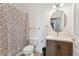 Cozy bathroom features a modern vanity and a decorative shower curtain at 6000 W Floyd Ave # 214, Denver, CO 80227