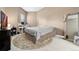 Comfortable bedroom with soft carpet, neutral paint, and a cozy rug at 6000 W Floyd Ave # 214, Denver, CO 80227