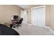 Comfortable bedroom with a large closet and neutral carpet and paint at 6000 W Floyd Ave # 214, Denver, CO 80227