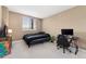 Bedroom with neutral walls and carpet, showcasing a cozy and adaptable space at 6000 W Floyd Ave # 214, Denver, CO 80227
