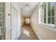 Well-lit hallway featuring neutral colors and modern design elements at 6000 W Floyd Ave # 214, Denver, CO 80227