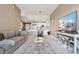 Open concept living room with view of the kitchen and entertainment center at 6000 W Floyd Ave # 214, Denver, CO 80227