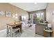 Cozy living room with glass doors to balcony and comfortable seating at 6000 W Floyd Ave # 214, Denver, CO 80227