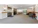 Open lobby with elevator, comfortable seating, and natural light at 6000 W Floyd Ave # 214, Denver, CO 80227