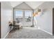 Sunlit seating area with windows, neutral tones, with carpet and accent lighting at 5708 E 10Th Ave, Denver, CO 80220