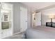 Bedroom with carpeted floors, attached bath, and spacious closet at 5708 E 10Th Ave, Denver, CO 80220