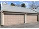 Attached two car garage with light tan doors and matching trim at 5708 E 10Th Ave, Denver, CO 80220