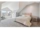 Well lit bedroom featuring a large bed, vaulted ceilings, a window seat and neutral tones at 5708 E 10Th Ave, Denver, CO 80220