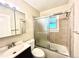 Bathroom featuring a tub, shower, toilet, and sink at 1965 Havana St, Aurora, CO 80010