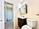 Bathroom with a toilet, sink, and vanity at 1965 Havana St, Aurora, CO 80010
