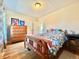 Bedroom with hardwood floors, dresser, and neutral paint at 1965 Havana St, Aurora, CO 80010