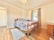 Cozy bedroom with hardwood floors and a large window at 1965 Havana St, Aurora, CO 80010