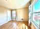 Bright bedroom featuring hardwood floors, neutral walls, and two sunny windows with stylish curtains at 1965 Havana St, Aurora, CO 80010