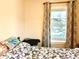 Comfortable bedroom featuring a window with patterned curtains and a serene atmosphere at 1965 Havana St, Aurora, CO 80010