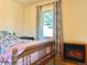 Bedroom with a window and electric fireplace at 1965 Havana St, Aurora, CO 80010