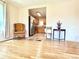 Living room with hardwood floors leading into an open kitchen at 1965 Havana St, Aurora, CO 80010