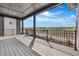 Spacious outdoor deck with black metal railings showcasing scenic views of the surrounding neighborhood at 6633 Bridlespur St, Castle Pines, CO 80108