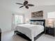 Serene bedroom with vaulted ceilings, soft lighting, and comfortable furnishings, creating a relaxing retreat at 8367 Devinney St, Arvada, CO 80005