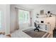 Charming home office with natural light, shiplap walls, a stylish desk, and ample storage, ideal for remote work at 8367 Devinney St, Arvada, CO 80005